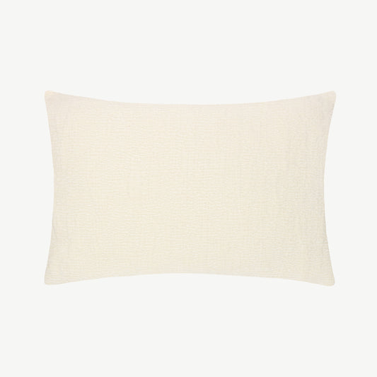 Chenille fabric throw cushion in neutral cream