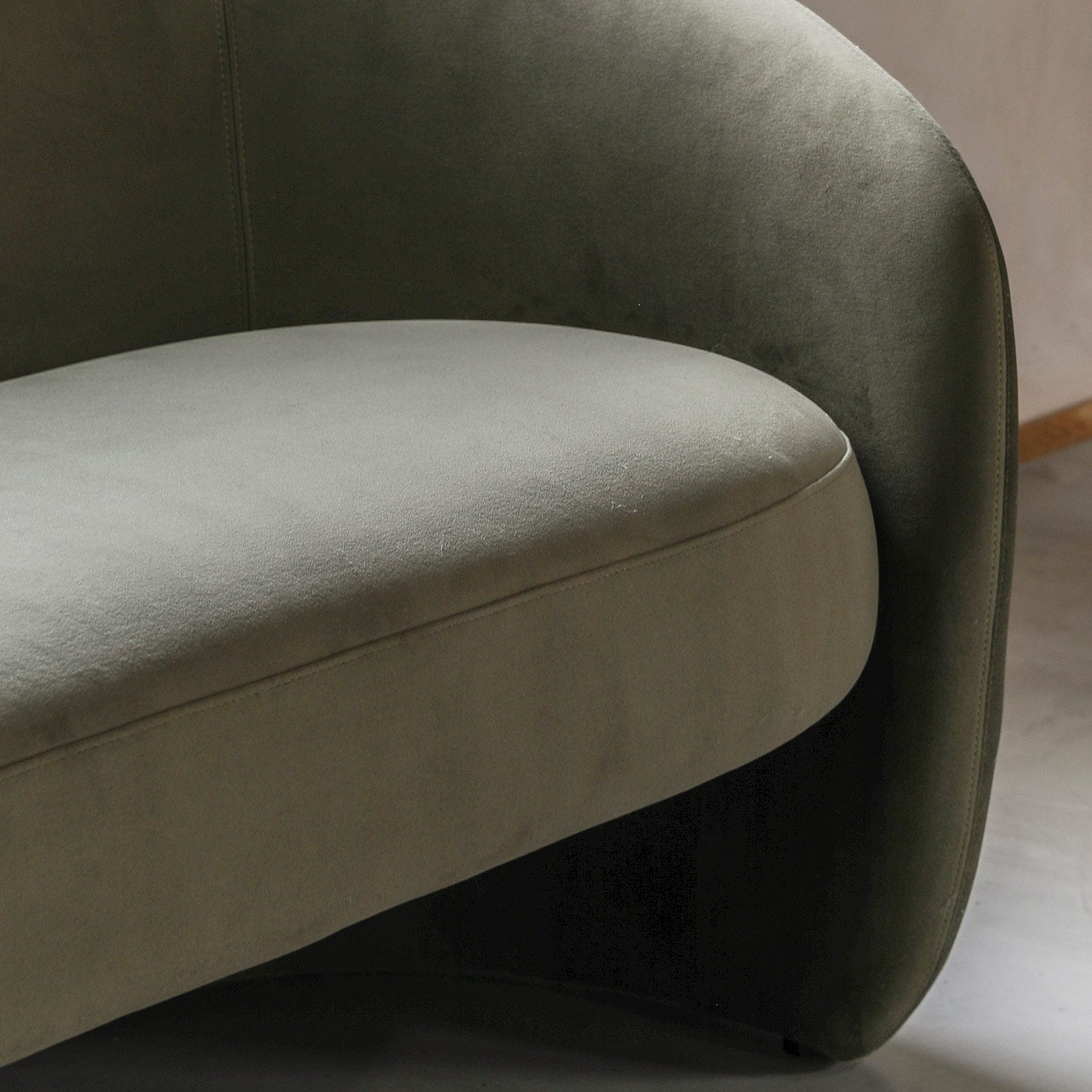 Contemporary curved 2 seater sofa in moss green fabric