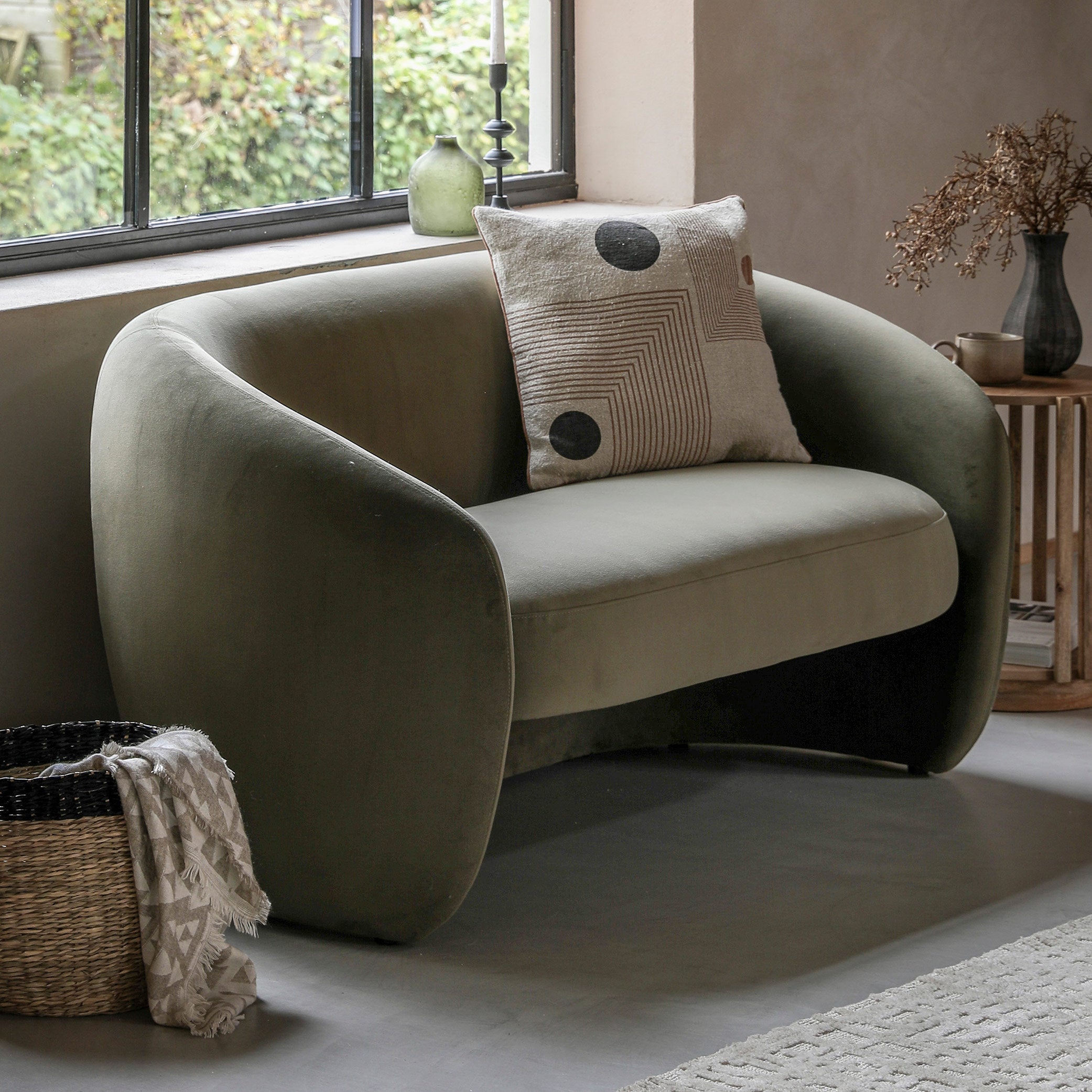Contemporary curved 2 seater sofa in moss green fabric