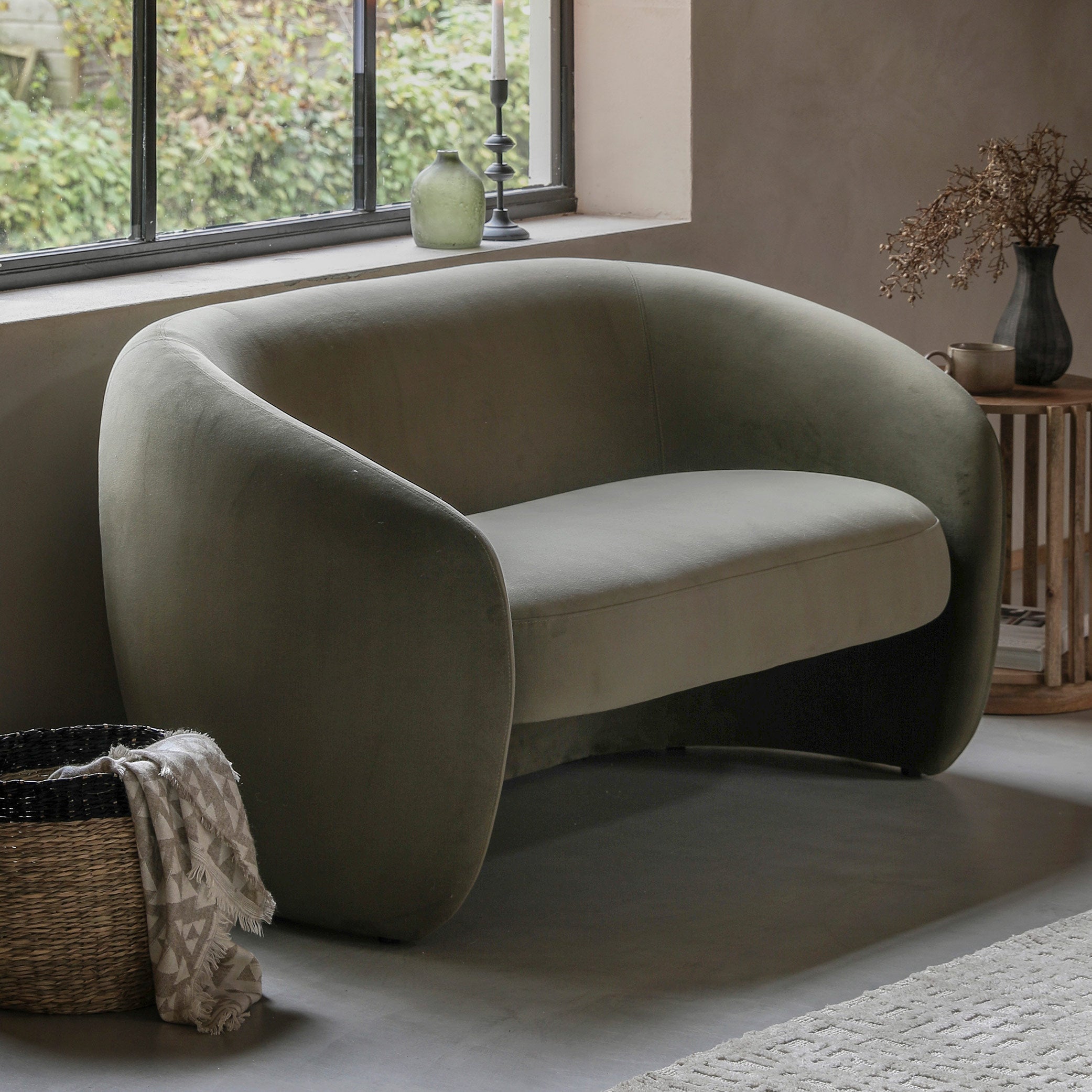 Contemporary curved 2 seater sofa in moss green fabric