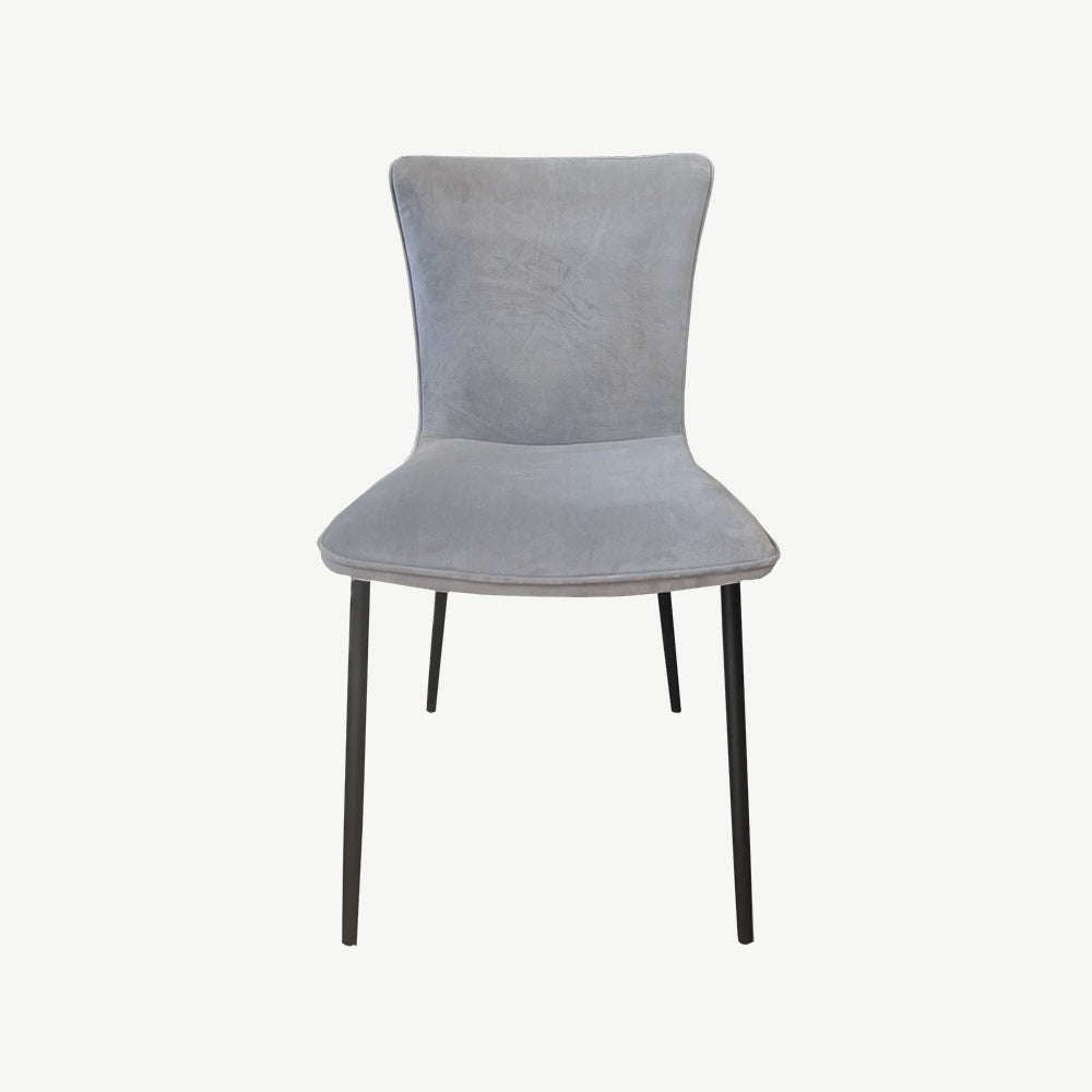 Grey velvet dining chair with black tapered legs