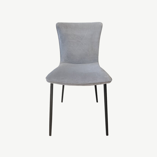 Grey velvet dining chair with black tapered legs