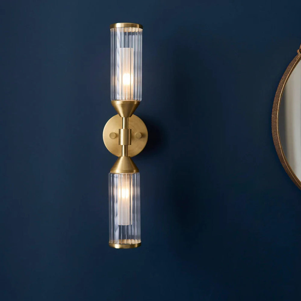 Double wall light in brushed brass finish clear ribbed glass shade