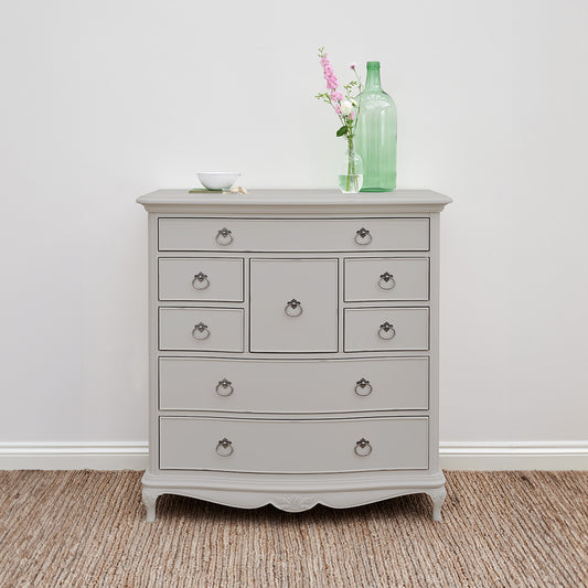 Grey dresser with decorative vase on top