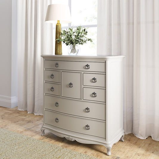 Grey dresser with decorative vase on top