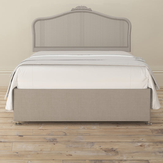 Chic grey rattan headboard with intricate detailing
