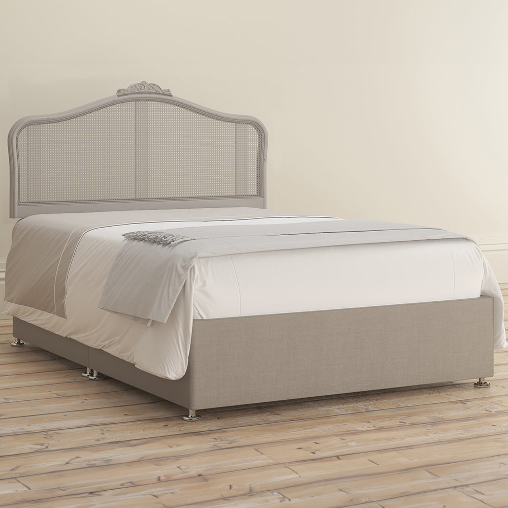 Chic grey rattan headboard with intricate detailing
