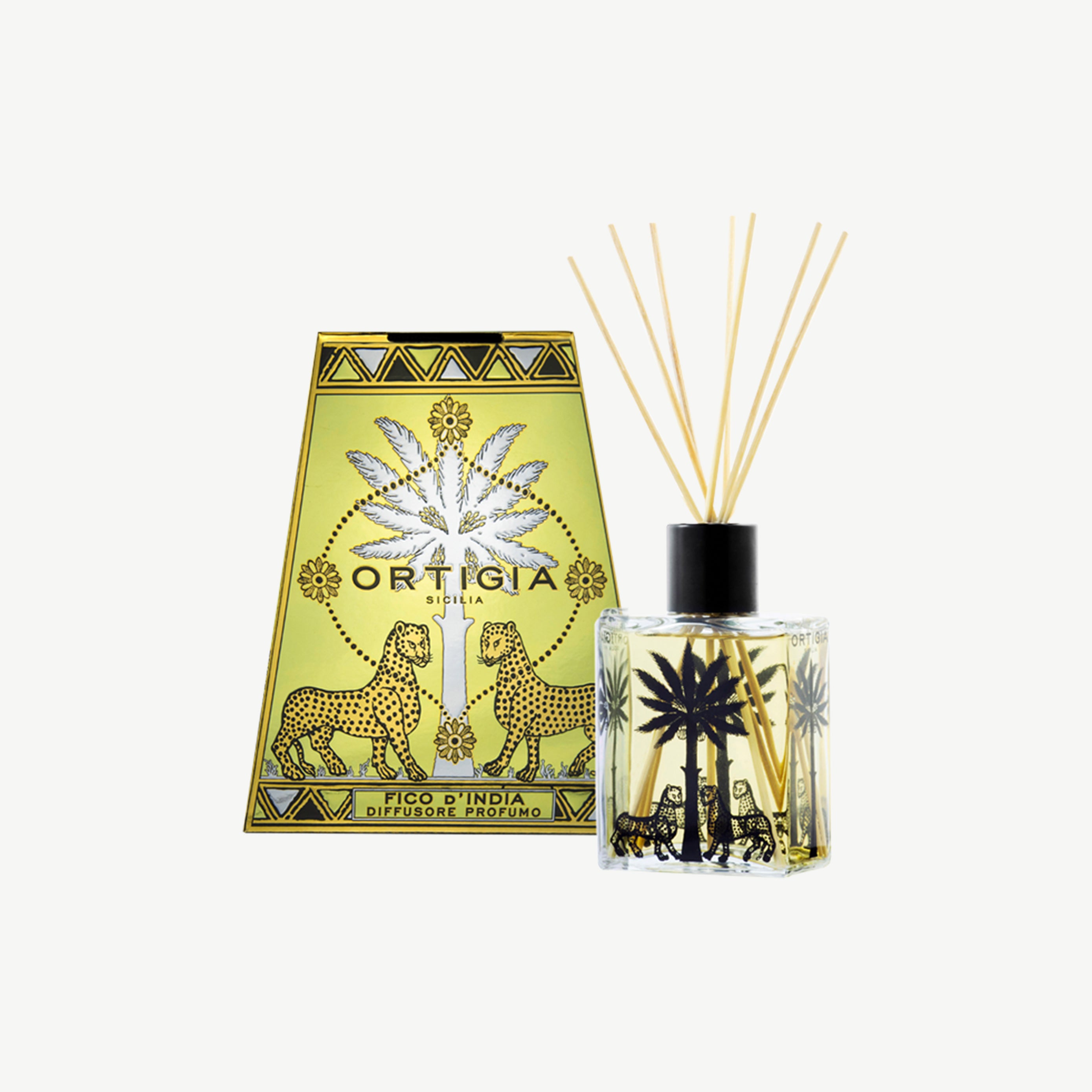 Ortigia Fico dIndia diffuser housed in ornate yellow tinted glass bottle with accompanying diffuser reeds