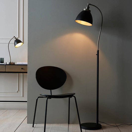 Authentic resto style adjustable floor light, finished in matt black paint with aged pewter plated details