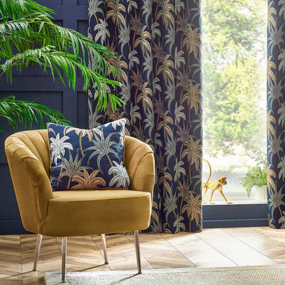 Exotic palm leaf print scatter cushion in blue, gold and white