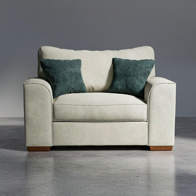 Beige armchair with two green cushions on a gray background