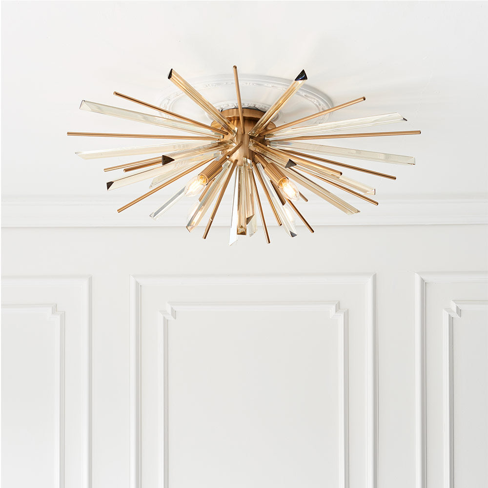 Flush light with antique brass metalwork, champagne triangular prism glass and decorative rods