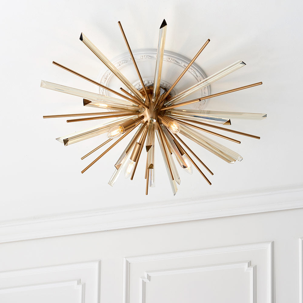 Flush light with antique brass metalwork, champagne triangular prism glass and decorative rods