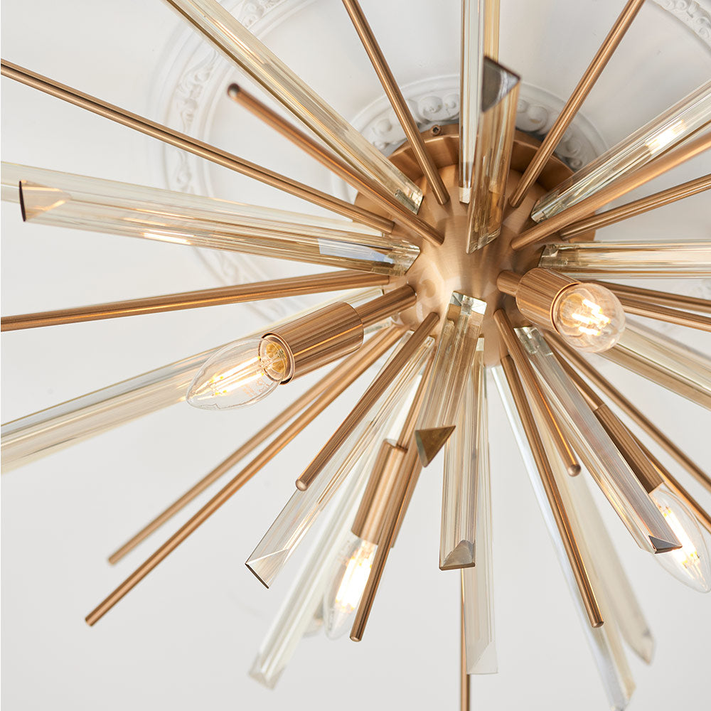 Flush light with antique brass metalwork, champagne triangular prism glass and decorative rods