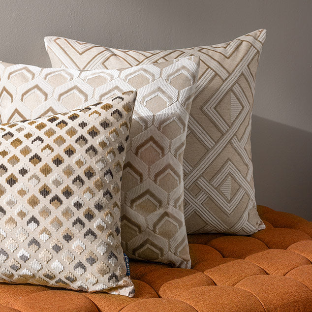 Sophisticated taupe scatter cushion with linear geometric pattern design and textured interlocking lines