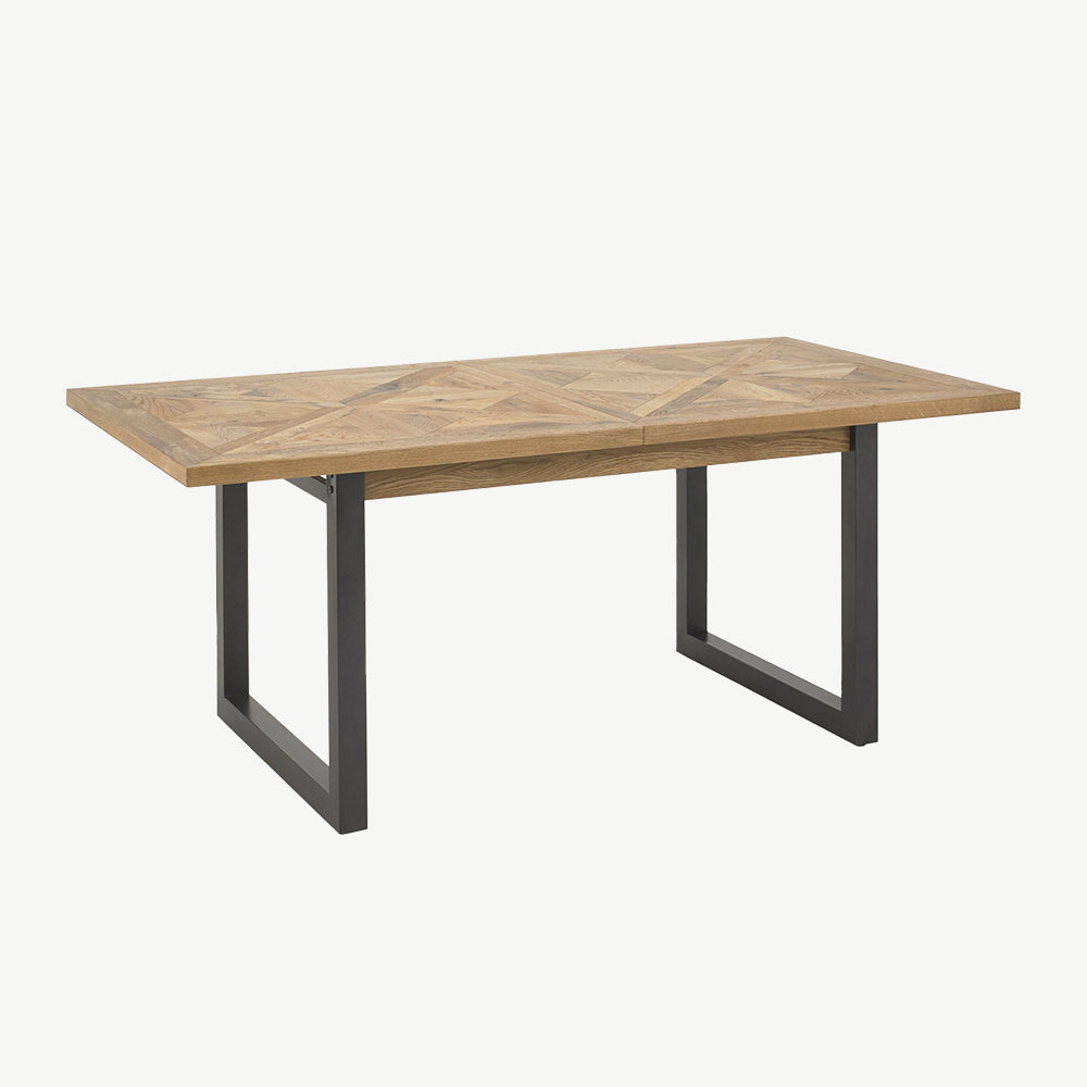 Oak veneer extending dining table with black powder coated metal base
