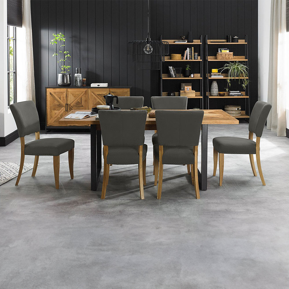 Oak veneer extending dining table with black powder coated metal base

