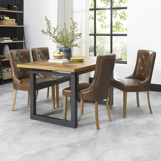 Oak veneer extending dining table with black powder coated metal base
