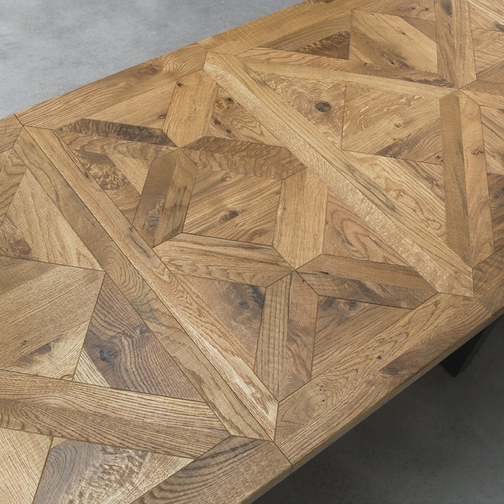 Oak veneer extending dining table with black powder coated metal base
