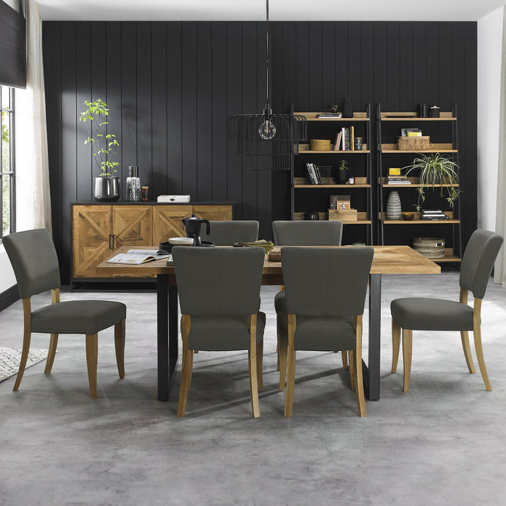 Oak veneer extending dining table with black powder coated metal base
