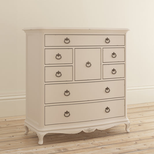 French inspired wooden 8 drawer chest in cream finish with eleven antique bronze handles 
