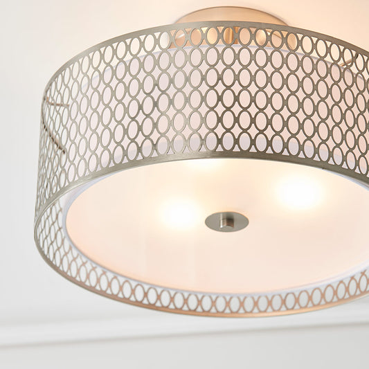 A simple, round flush-mounted ceiling light with a clean, minimalist design, typically providing even, diffused lighting.