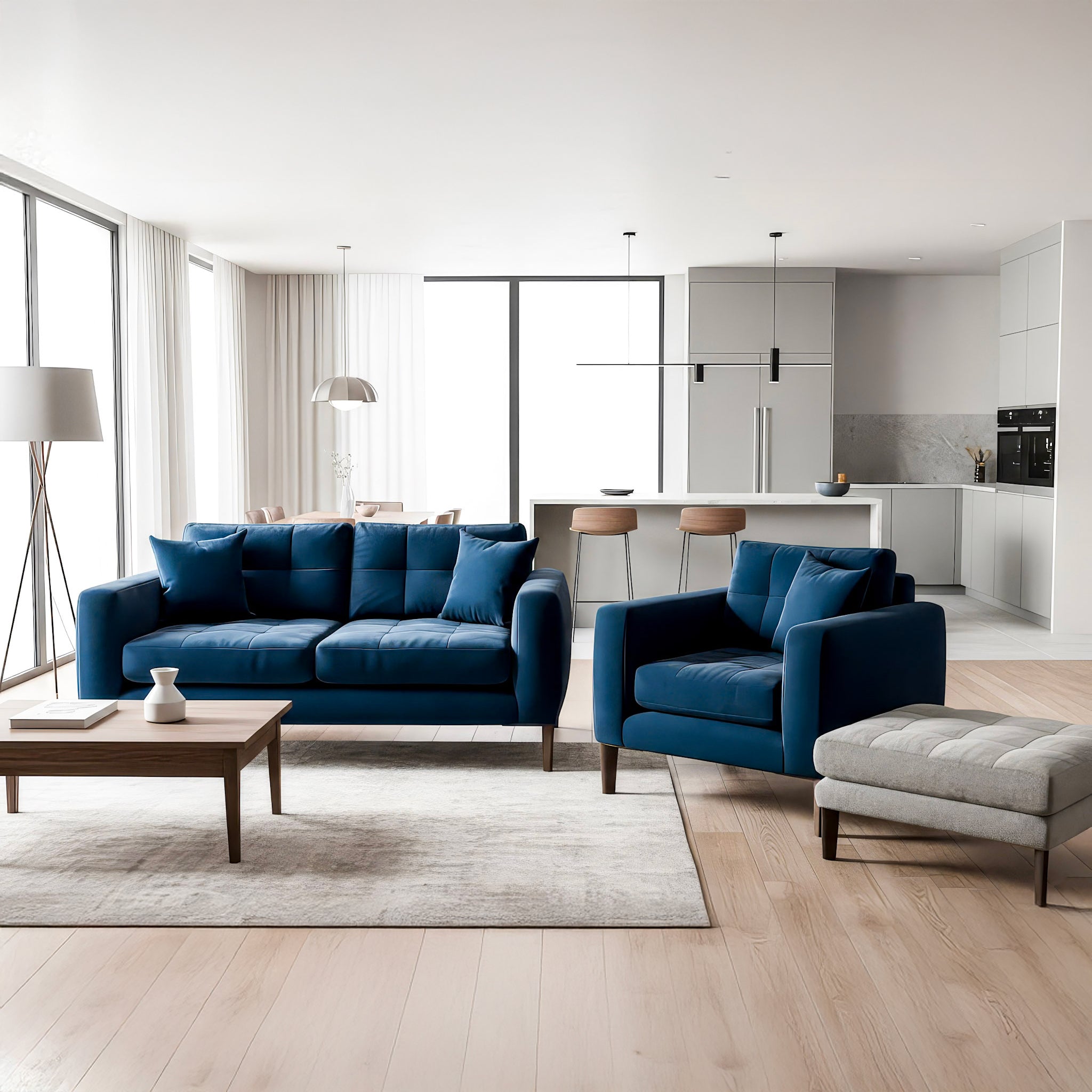 Modern living room with blue sofas and a kitchen in the background