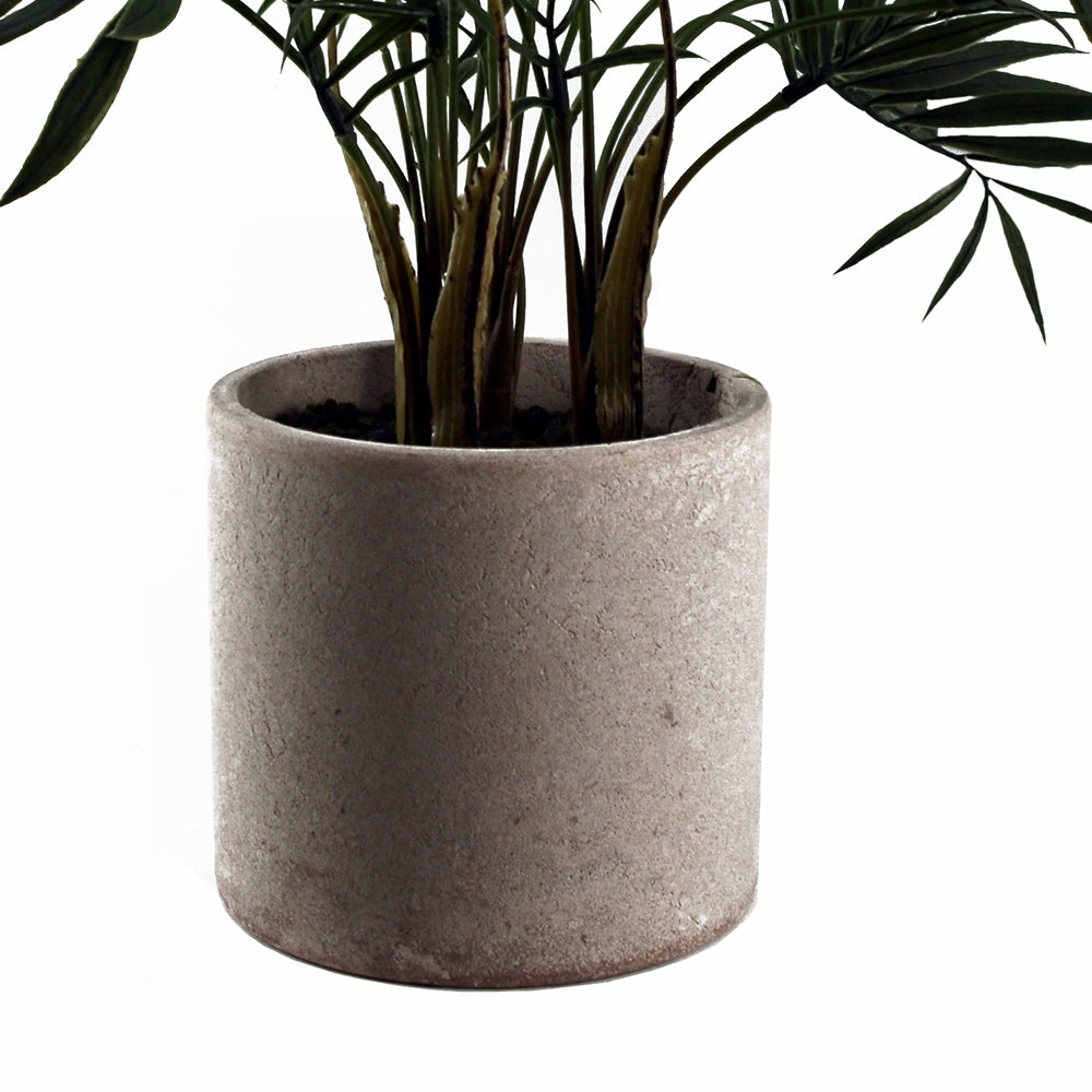 Artificial mini palm in neutral pot