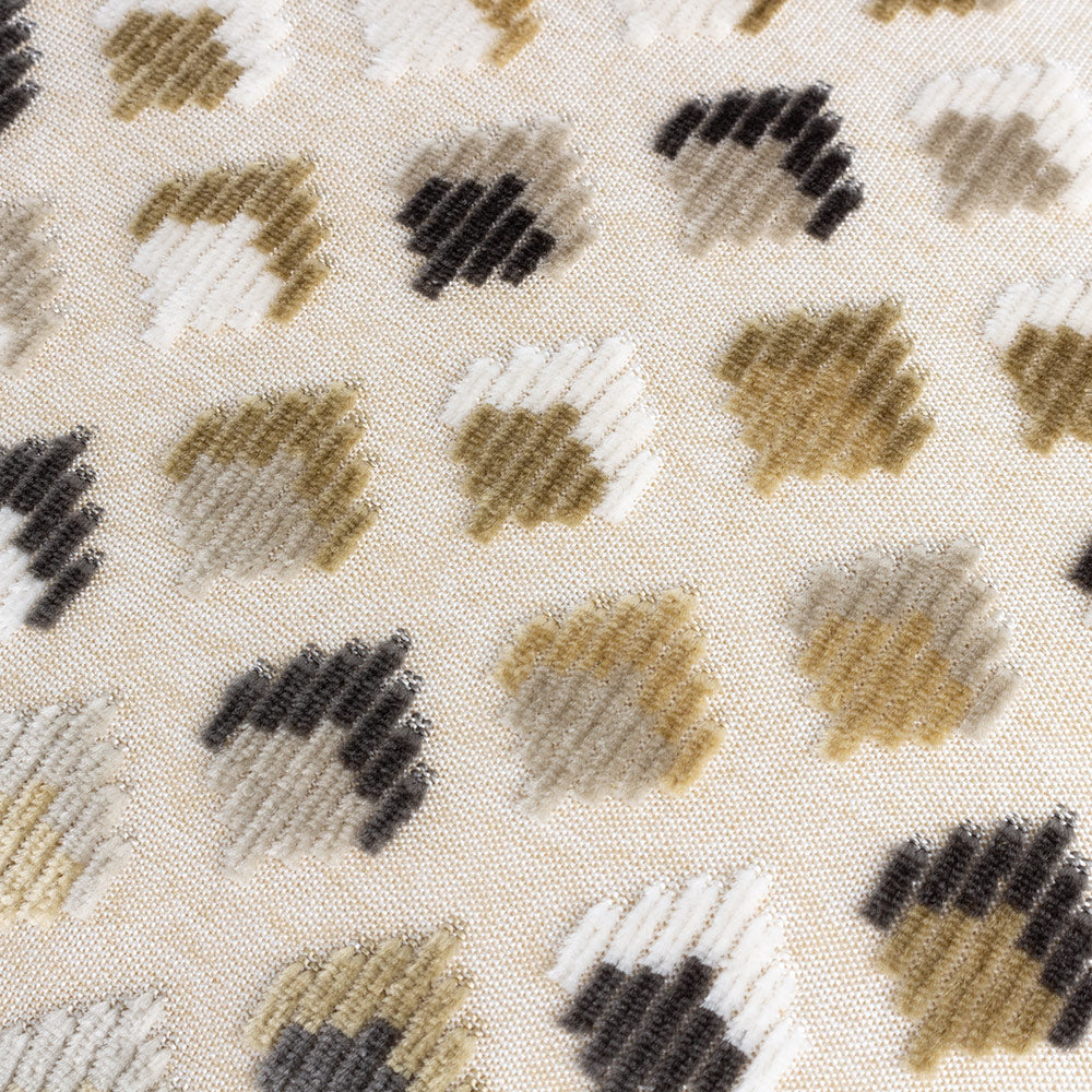 Rectangular scatter cushion featuring raised chequered design in varying hues of brown, white and gold with reverse plain side