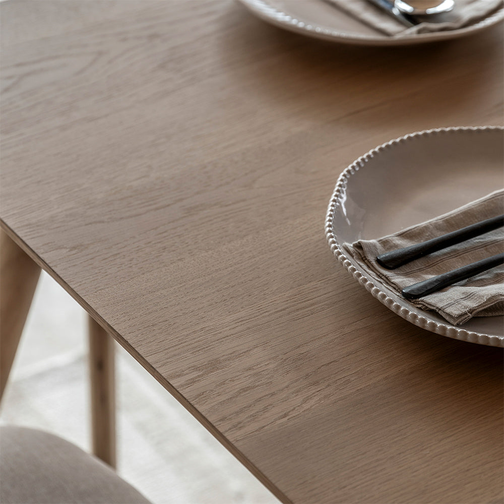 Rectangular wooden dining table in natural oak finish
