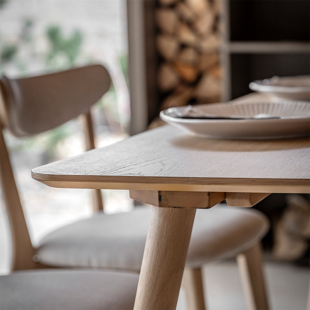 Rectangular wooden dining table in natural oak finish