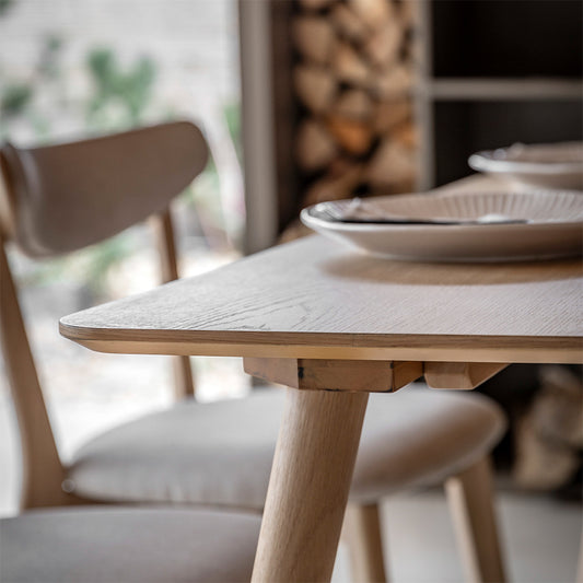 Rectangular wooden dining table in natural oak finish