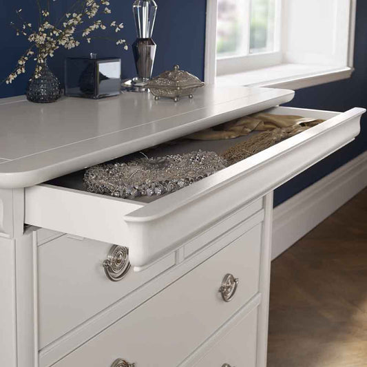 Wooden 2 and 4 drawer chest in painted white finish with silver handles
