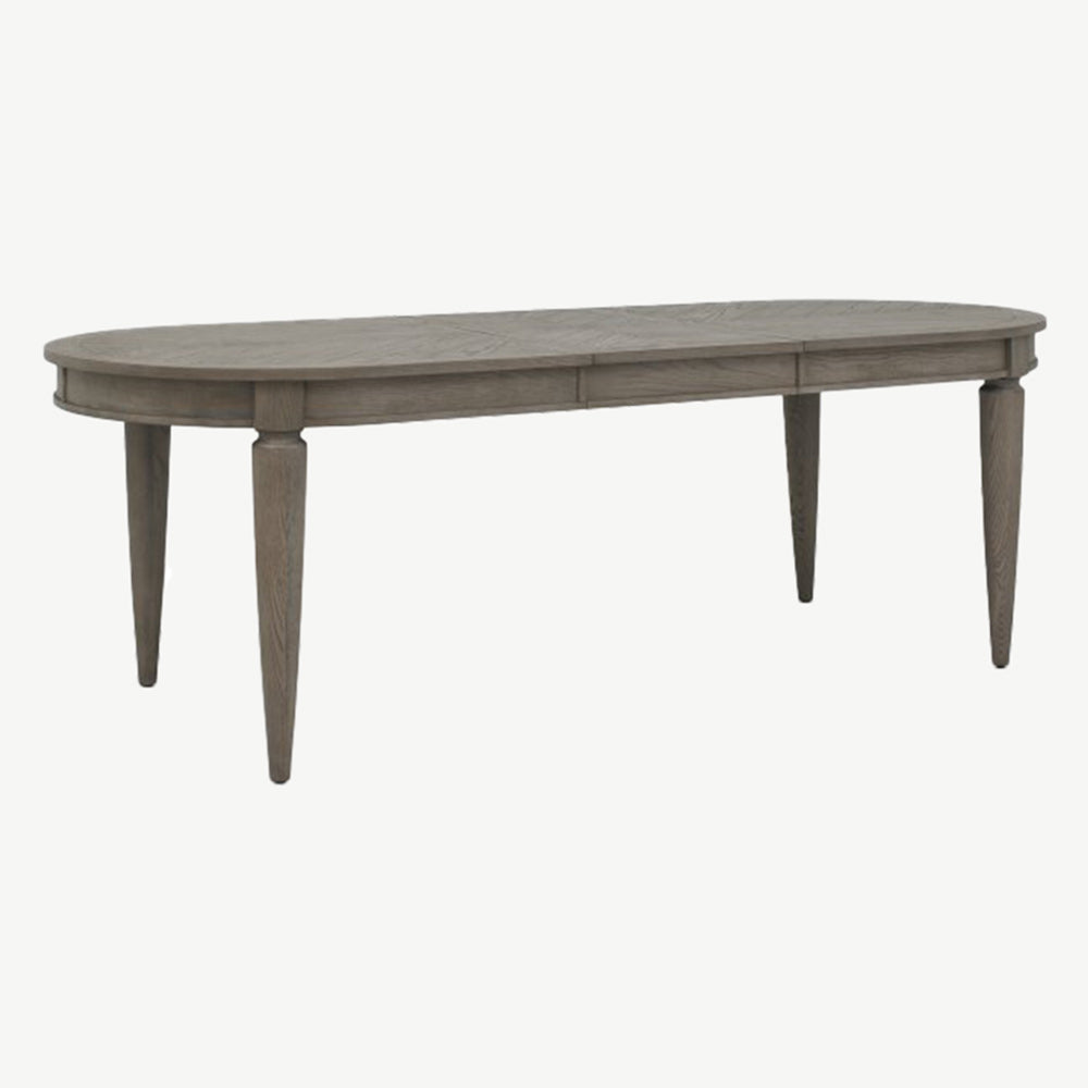 Oval shaped extending wooden dining table with saw-cut ash chevron pattern in silver grey finish