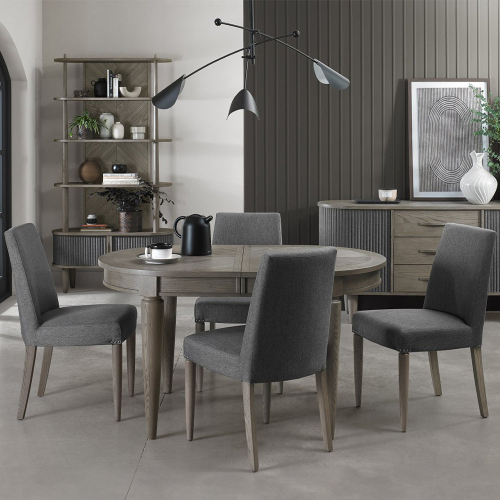 Oval shaped extending wooden dining table with saw-cut ash chevron pattern in silver grey finish