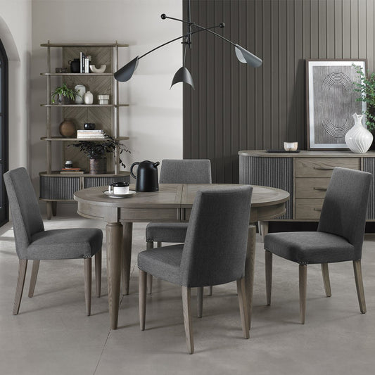 Oval shaped extending wooden dining table with saw-cut ash chevron pattern in silver grey finish