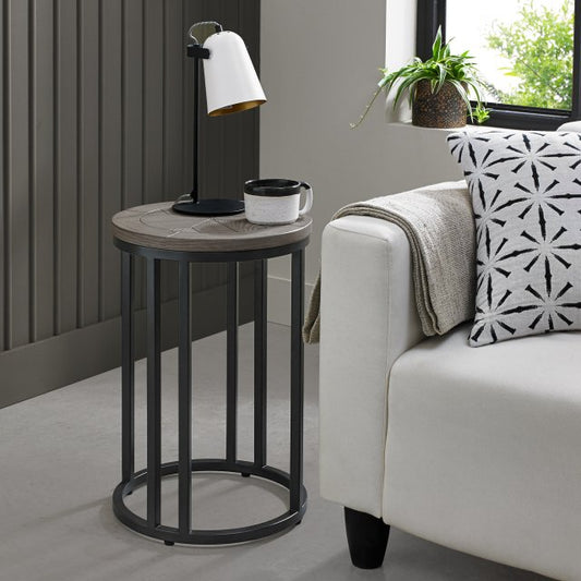 Wooden side table with saw-cut ash chevron pattern in silver grey finish and black powder coated metal base