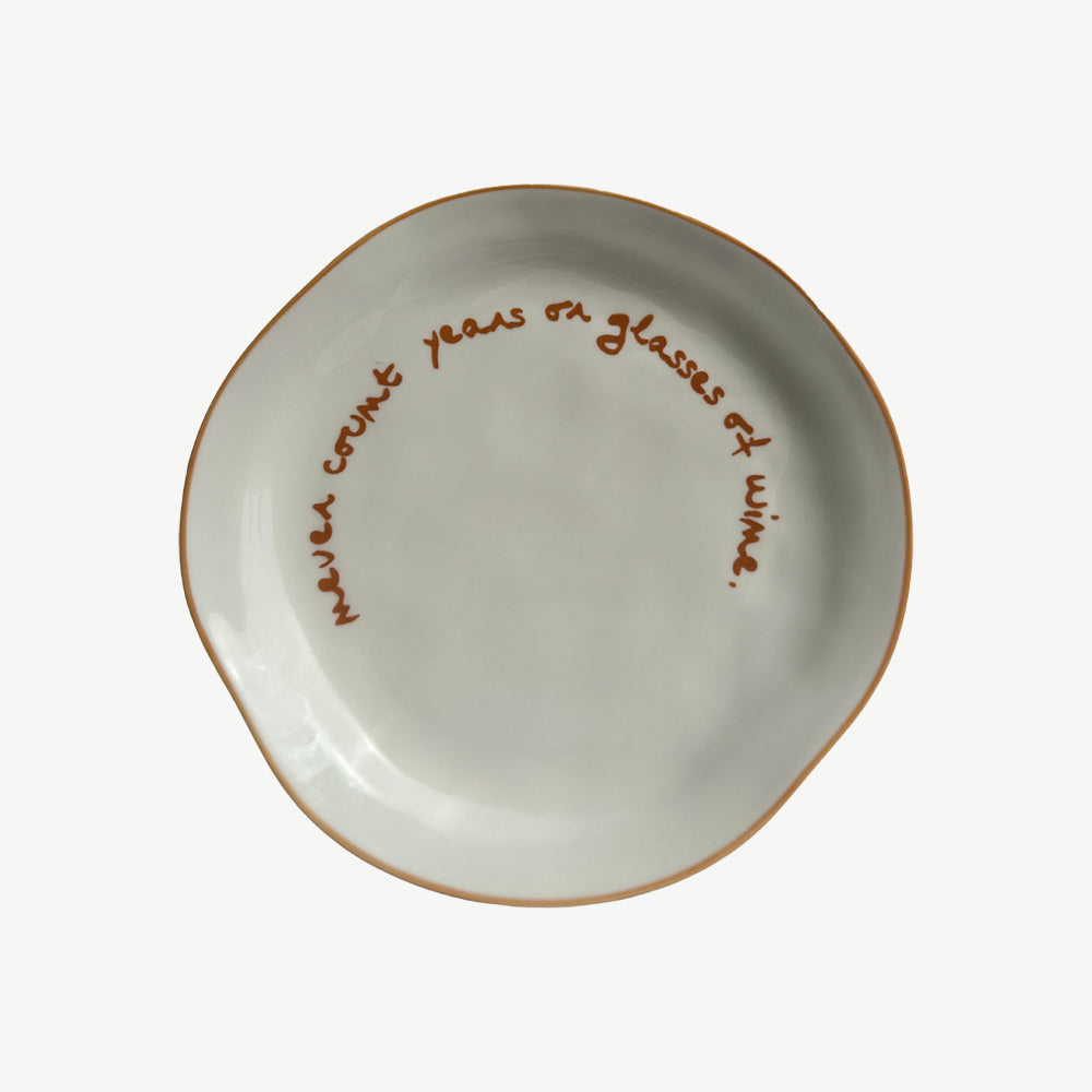 "Never count years or glasses of wine" Orange Decorative Plate