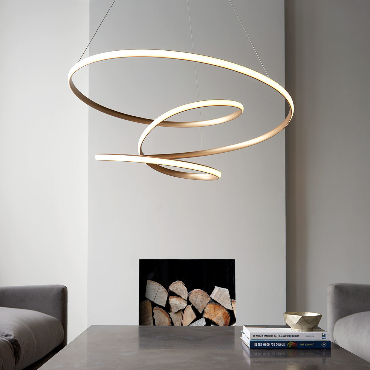 Contemporary gold finished spiral pendant with matt white diffuser