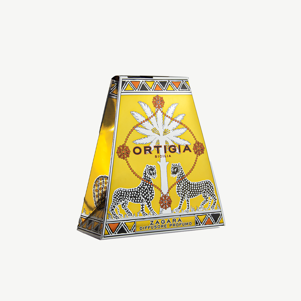 Ortigia Zagara diffuser in signature clear glass printed bottle and accompanying natural diffuser reeds