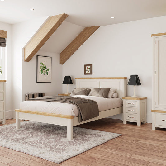 Painted off-white bedframe with natural wood accents 
