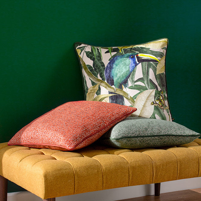 Embroidered toucan and jungle print scatter cushion in emerald hue with plain green reverse side