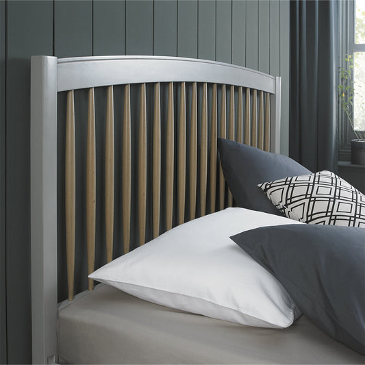 Pale oak bedframe in light grey finish with spindle headboard
