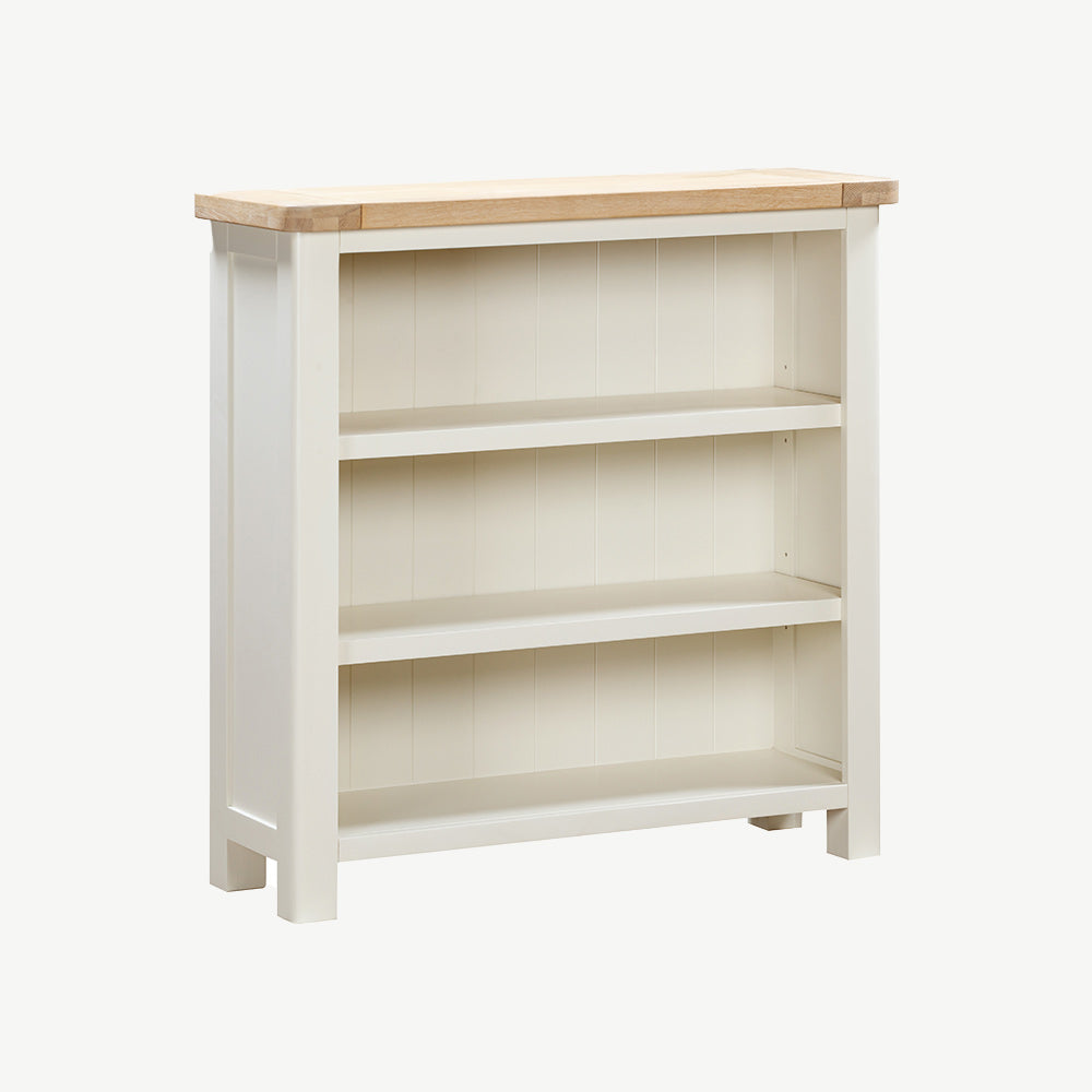 Painted off-white bookcase with natural wood top and three spacious shelves
