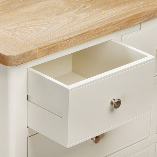 Painted off-white 3 over 4 drawer chest with natural wood top, three top drawers and 4 bottom drawers
