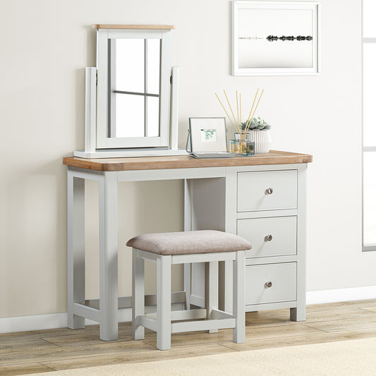 Painted off-white dressing table set with natural wood top, three drawers and matching stool with upholstered seat