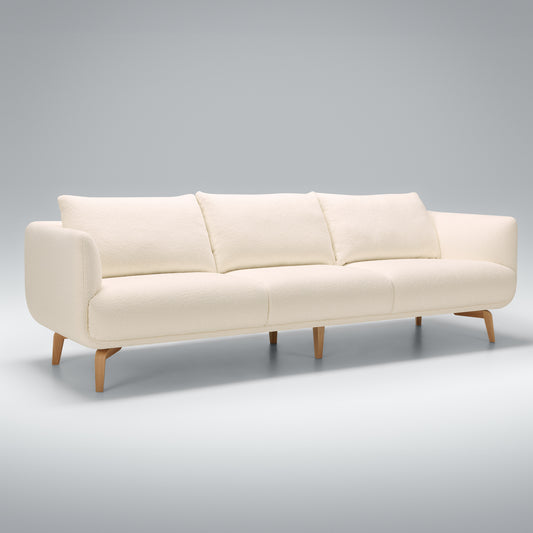 Sits Moa 4 Seater Sofa in boucle cream fabric with wooden legs