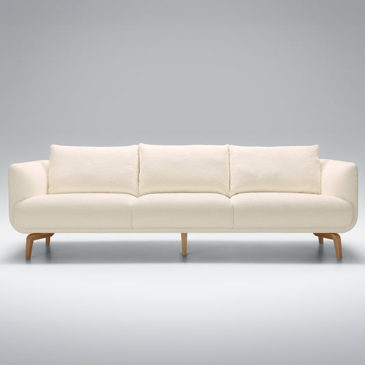 Sits Moa 4 Seater Sofa in boucle cream fabric with wooden legs