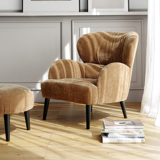 Sits ross chair boasting tapered wooden legs and soft brown upholstery, creating a warm and inviting atmosphere