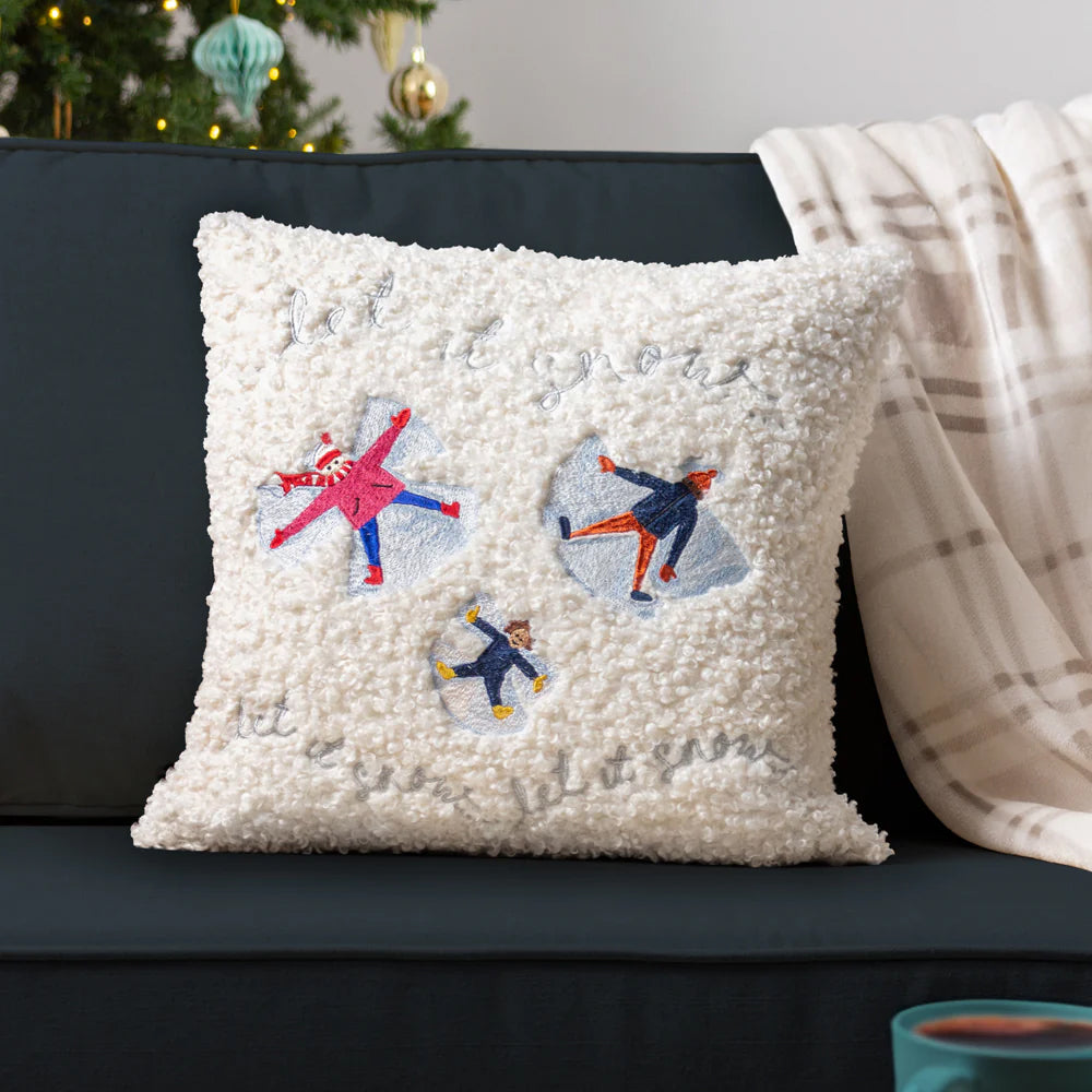 Decorative Christmas pillow with embroidered snow angels 